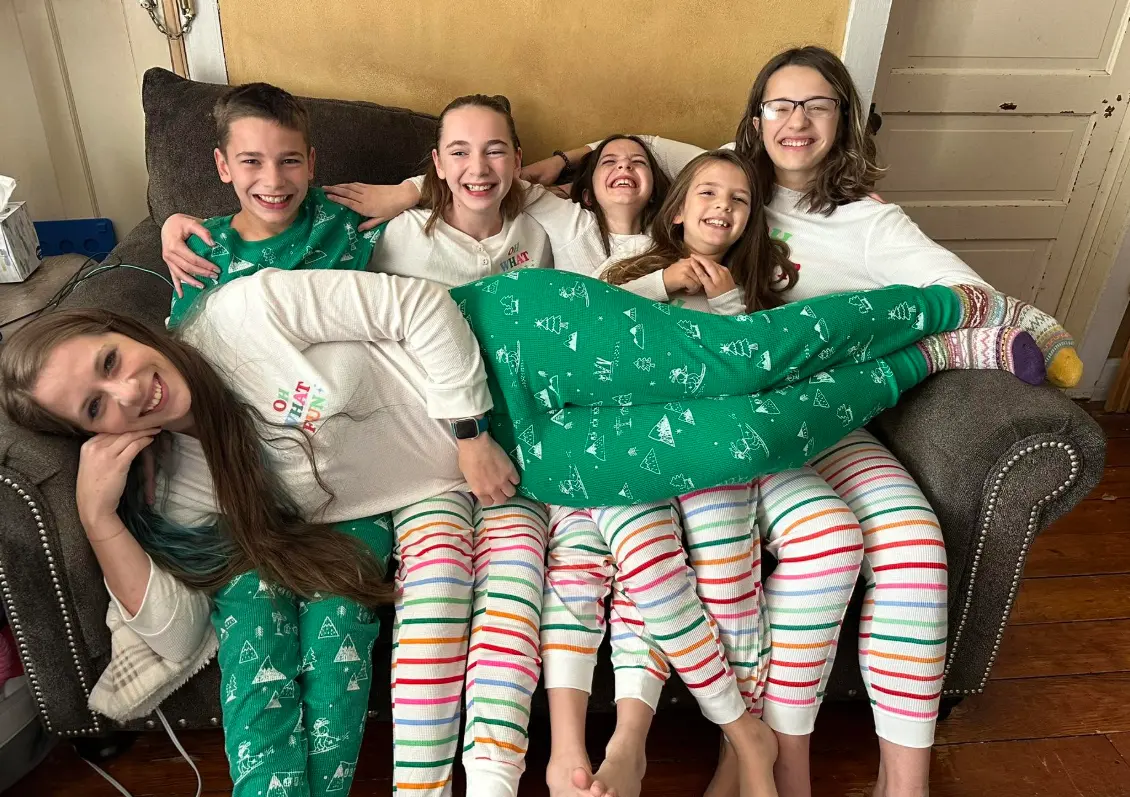 Rachel laughing with her five children